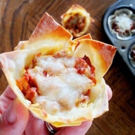 These are yummy tiny lasagna cups of happiness made of Wonton wrappers.So delicious you can’t resist! Perfect for parties&football season.