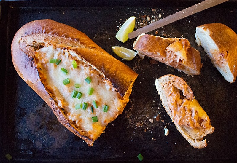 This Buffalo Chicken French Bread is the ultimate game day or any fun day food! It's beyond delicious! 