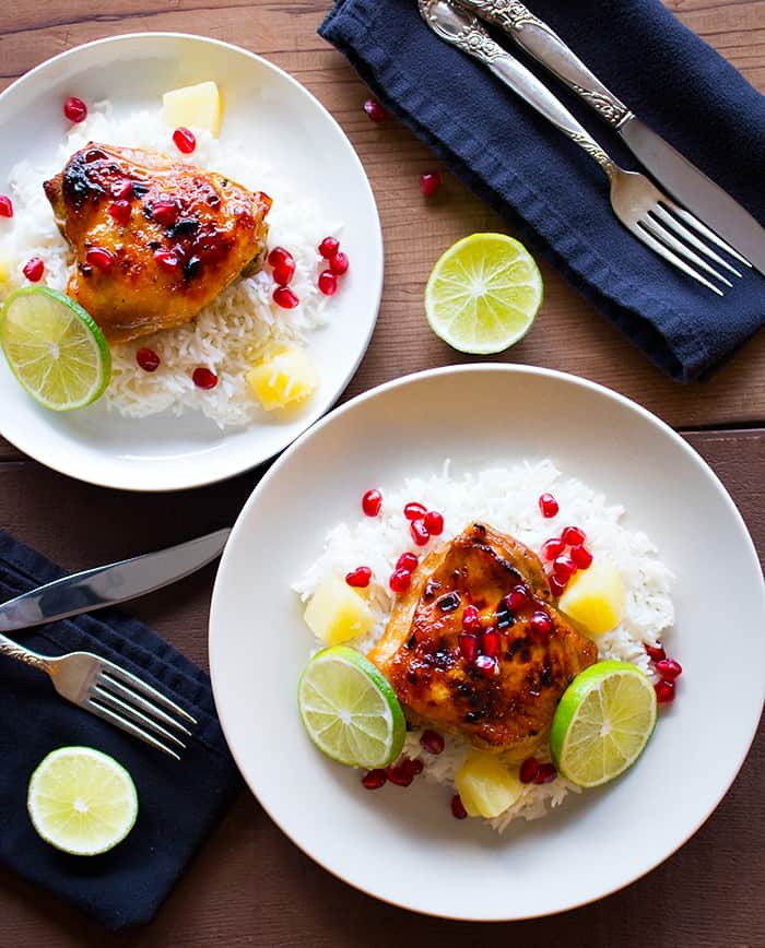 baked pineapple chicken thighs with white rice. 