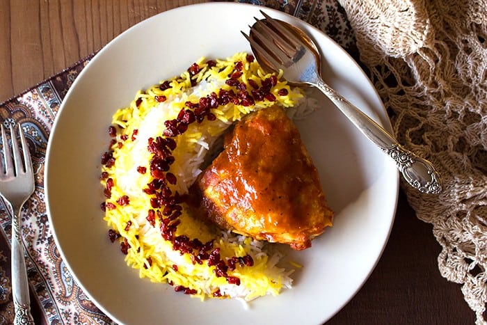 Zereshk polo morgh is a dish full of amazing flavors including saffron!