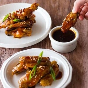 Sweet and Sour Baked Chicken Wings make you fly! Baked in the oven (so no mess!) and tossed in a sauce that you can literally use for anything! With video!