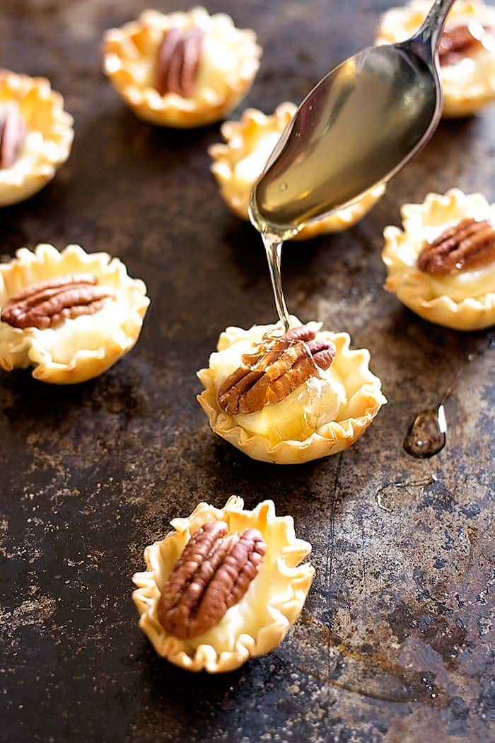 drizzle honey on pecan and brie phyllo cups for more flavor.