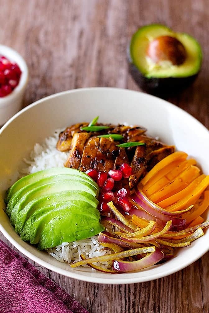 Turn the boring leftover chicken into an outstanding dish with this recipe! Chicken and veggie rice bowl is easy, pretty and full of flavor! 