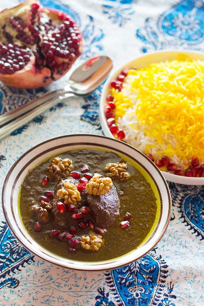 Dive in to Persian deliciousness! Khoresht Fesenjan is a wonderful combination of pomegranate and walnut served with Persian style rice and saffron.