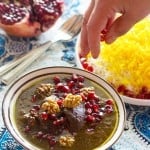 Dive in to Persian deliciousness! Khoresht Fesenjan is a wonderful combination of pomegranate and walnut served with Persian style rice and saffron.