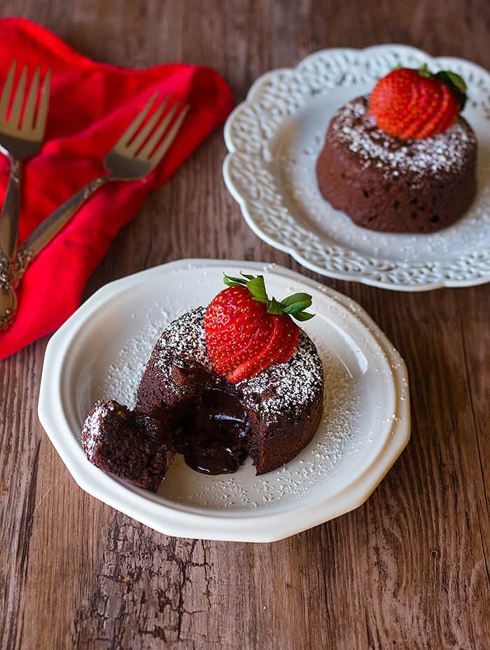 Molten chocolate lava cake made served with strawberries. 