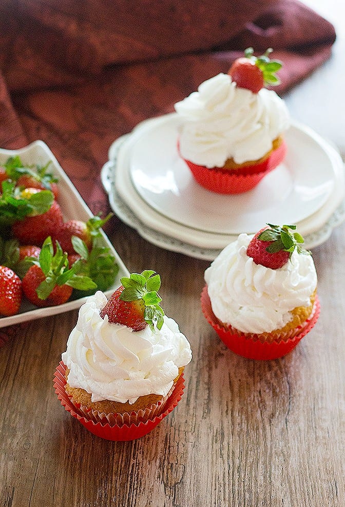 Strawberry Cheesecake Cupcakes are a match made in heaven! Enjoy them the most by adding some strawberries! They are fluffy, fresh and irresistibly delicious! 