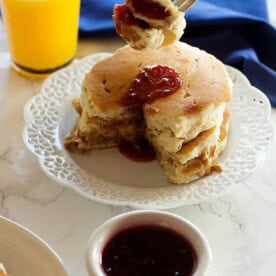 Peanut Butter and Jelly Pancakes are two favorite breakfast foods in one! They are fluffy with a center of creamy peanut butter and jelly. It can't get any better!