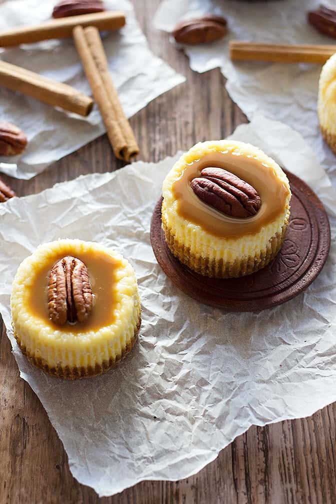 Enjoy a bite of happiness with these cute Caramel Pecan Cheesecake made in a muffin pan. They're velvety, creamy and have a perfect balance of sweetness!