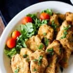 These Baked Garlic Parmesan Chicken Strips are easy and super delicious. A healthier version of one of the most favorite foods out there!