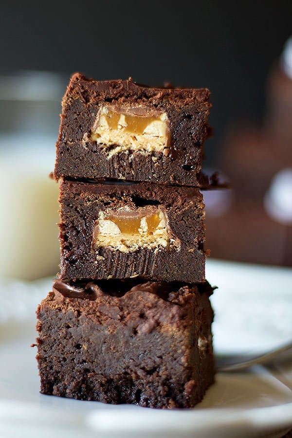 These are the best Snickers Brownies that will wow your crowd! They look like usual brownies but when you bite into them, there is a peanut party!