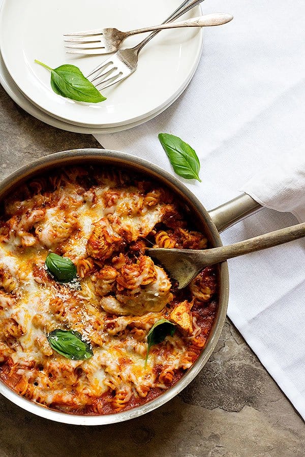 A healthier version of an all-time favorite, this One Pan Chicken Parmesan Pasta is great for weeknight dinners and is ready in less than 40 minutes!