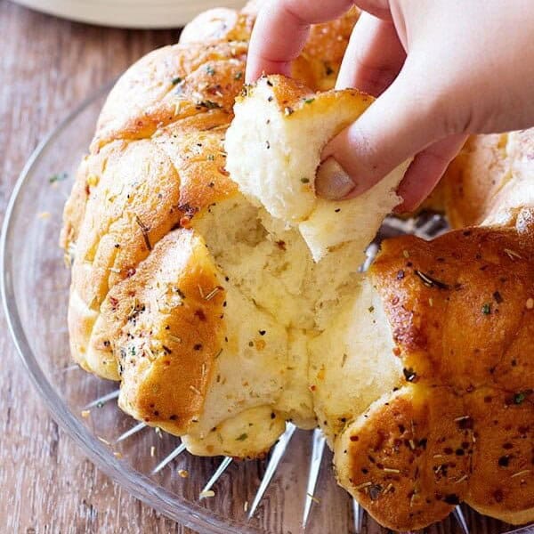 This cheesy rosemary garlic monkey bread is so easy to make, you will want to make it everyday! Serve it with a delicious marinara sauce to enjoy all the good flavors to their fullest!