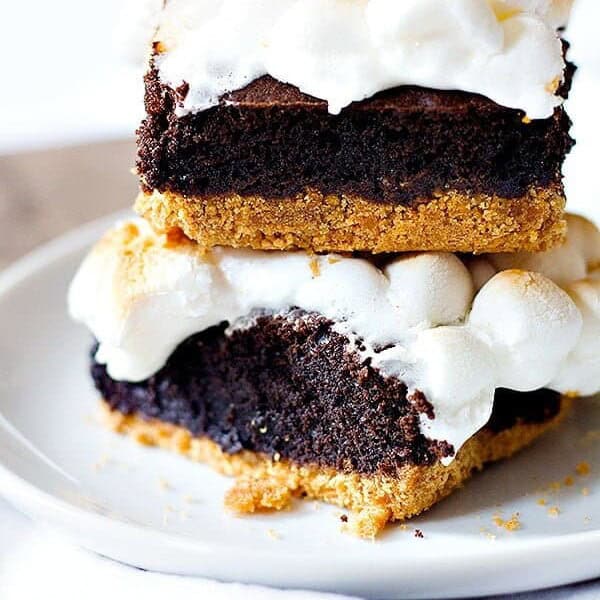 Two favorite desserts in one! S'mores Brownies are going to be your new favorite. Delicious graham cracker crust topped with brownie batter and finished with ooey gooey marshmallows. What's not to like?