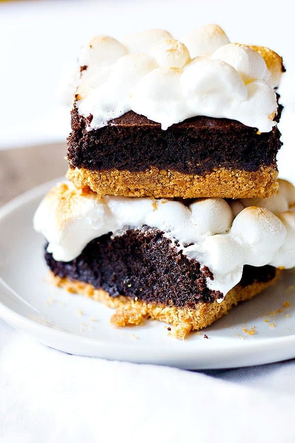 Two favorite desserts in one! S'mores Brownies are going to be your new favorite. Delicious graham cracker crust topped with brownie batter and finished with ooey gooey marshmallows. What's not to like?