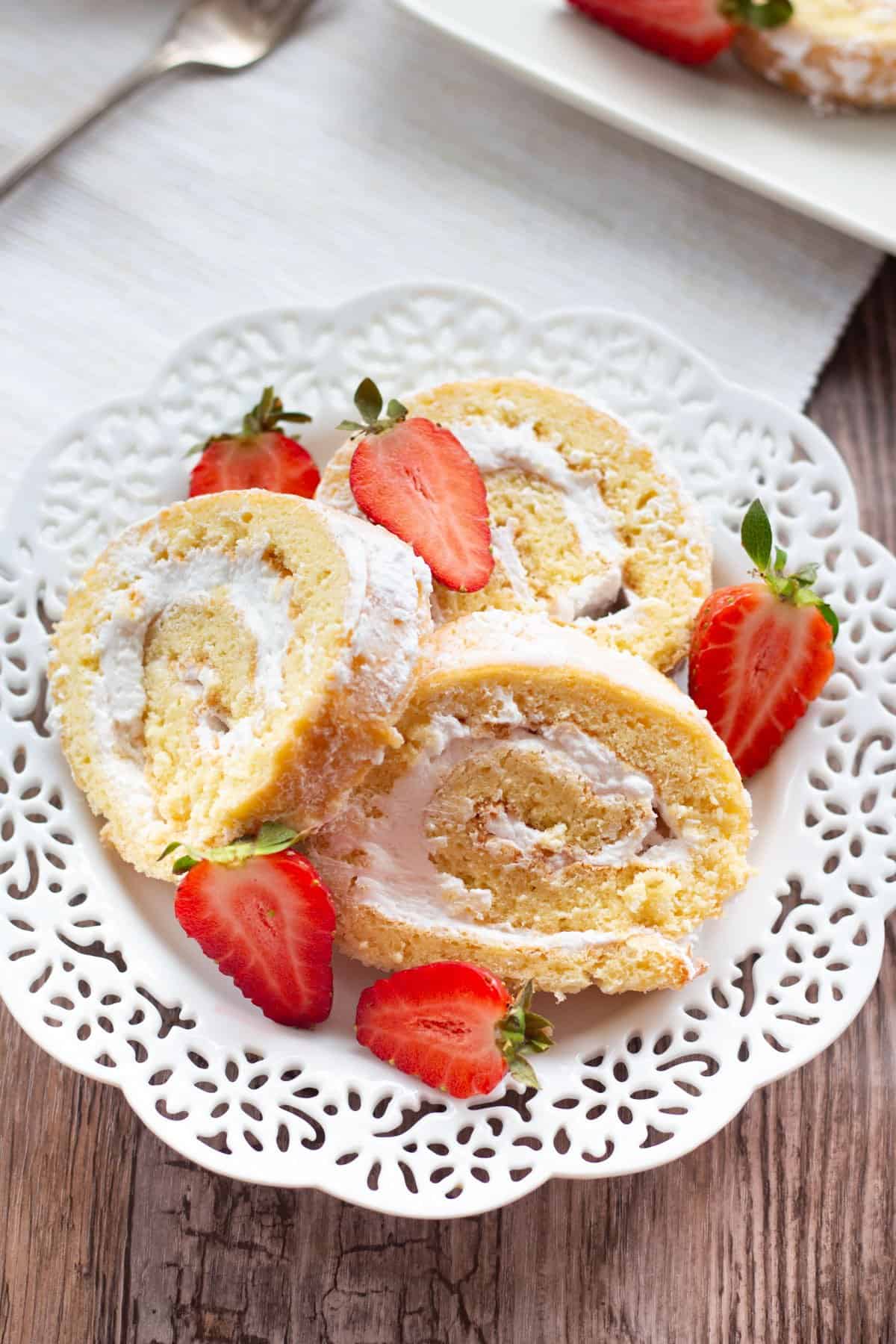 This strawberry cream swiss roll is the ultimate summer treat! It's airy, delicious, and full of whipped cream. Making a swiss roll at home is way easier than what you may think!