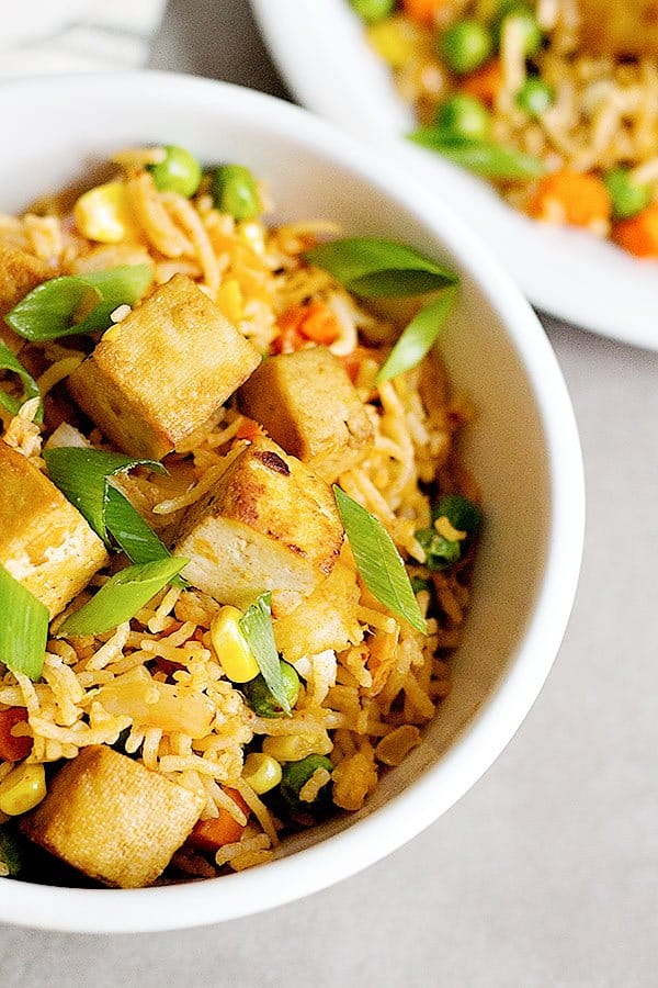 Tofu Kimchi Fried Rice is an easy dish that you can make at home all the time. The baked and seasoned tofu gives this fried rice a wonderful flavor!
