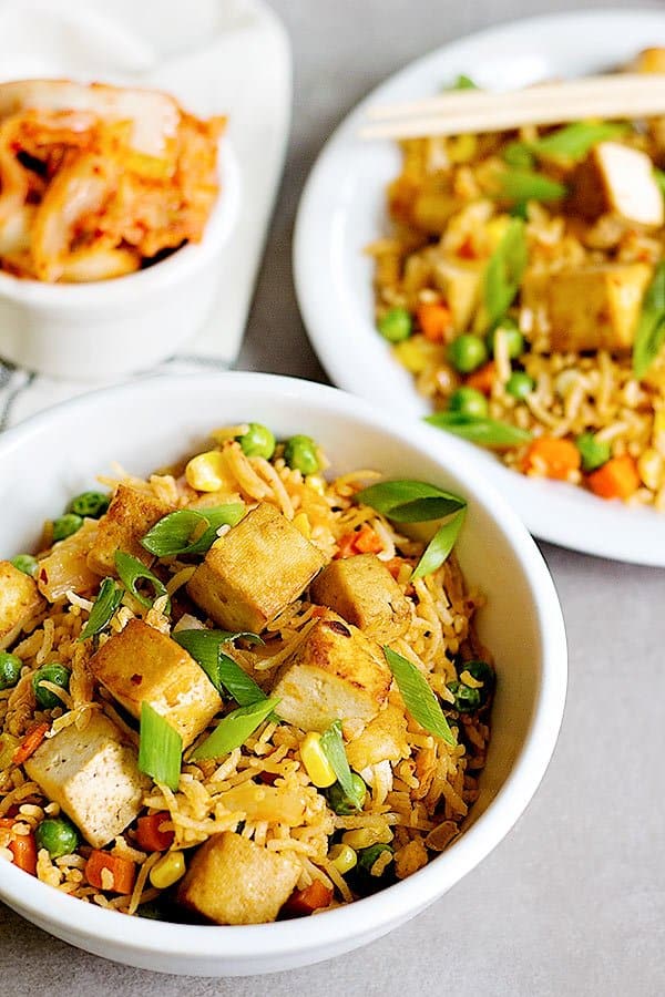 Tofu Kimchi Fried Rice is an easy dish that you can make at home all the time. The baked and seasoned tofu gives this fried rice a wonderful flavor! 