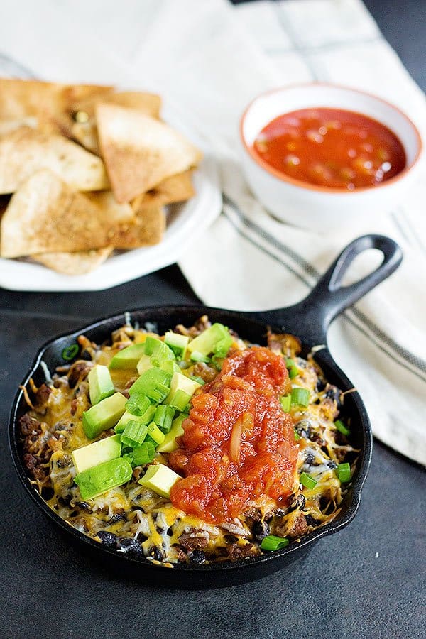 This cheesy taco dip will be the star of your parties and gathering! Serve it with homemade rosemary garlic tortilla chips for more flavor! Game days are going to be delicious! 