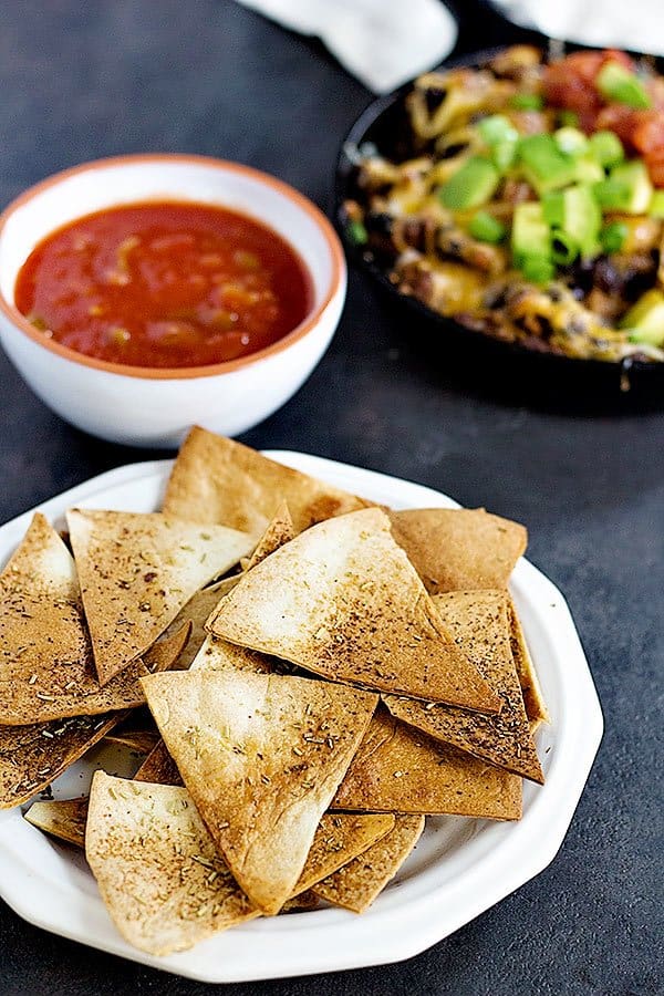 This cheesy taco dip will be the star of your parties and gathering! Serve it with homemade rosemary garlic tortilla chips for more flavor! Game days are going to be delicious! 