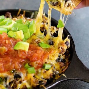 This cheesy taco dip will be the star of your parties and gathering! Serve it with homemade rosemary garlic tortilla chips for more flavor! Game days are going to be delicious!