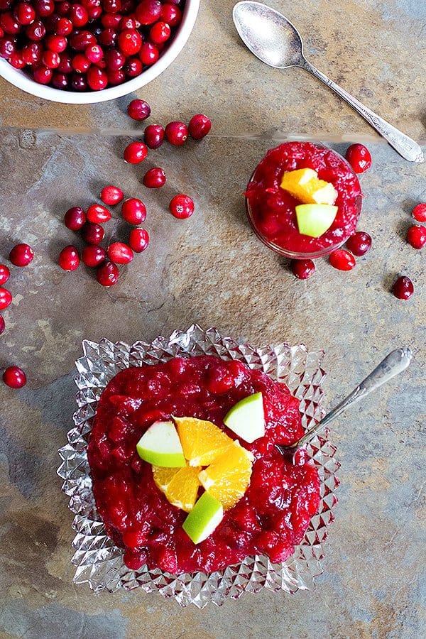 Cranberry apple sauce made with fresh cranberries and oranges is tasty. 