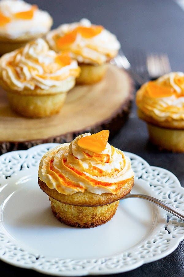 These Peanut Butter Chocolate Stuffed Vanilla Cupcakes are perfect for any gathering! It can't get any better than fluffy and moist vanilla cupcakes filled with a peanut butter chocolate filling!