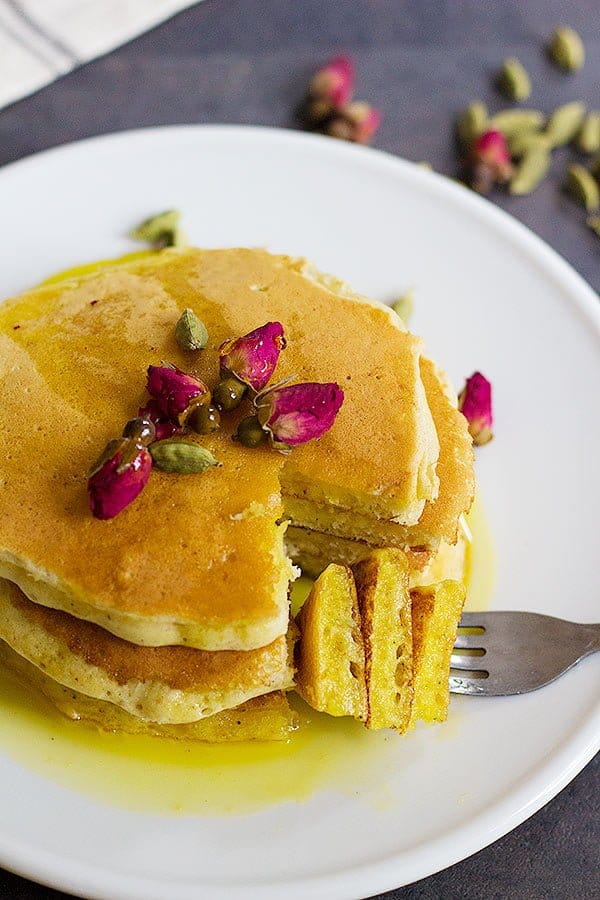 A classic American recipe with a Persian twist, these rosewater cardamom pancakes with saffron syrup are the love between east and west. The fluffy pancakes with rose and cardamom aroma kissed by saffron syrup, a dream come true! 