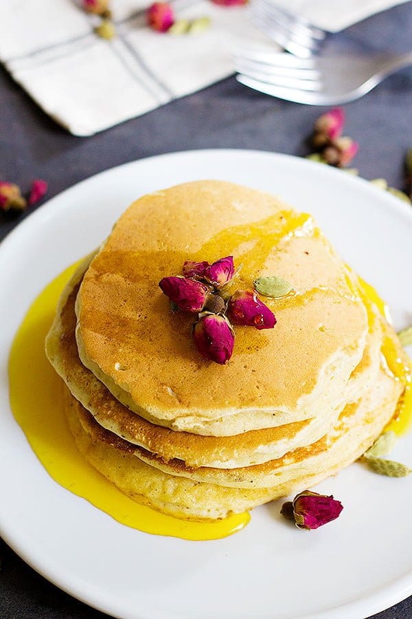 A classic American recipe with a Persian twist, these rosewater cardamom pancakes with saffron syrup are the love between east and west. The fluffy pancakes with rose and cardamom aroma kissed by saffron syrup, a dream come true! 