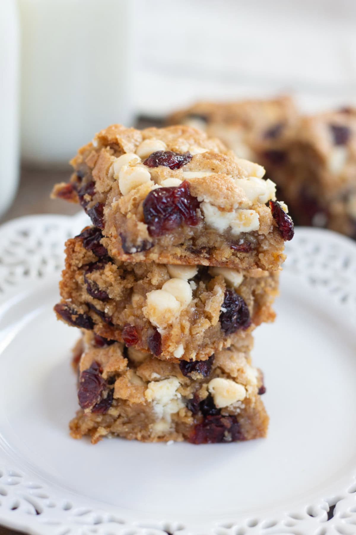 These Cranberry White Chocolate Oatmeal Cookie Bars have all the good flavors in one single bite! Sweet and tart cranberries go very well with festive white chocolate morsels!