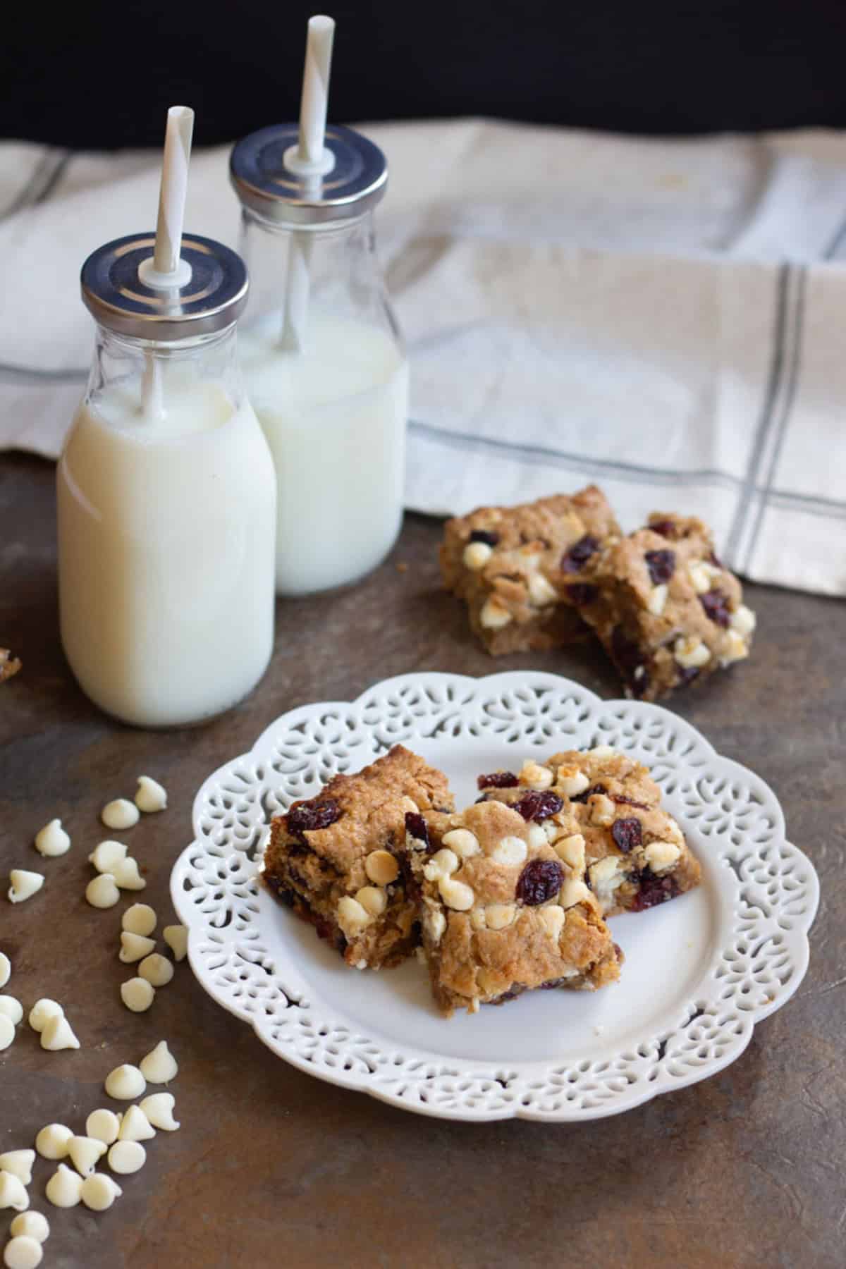 These Cranberry White Chocolate Oatmeal Cookie Bars have all the good flavors in one single bite! Sweet and tart cranberries go very well with festive white chocolate morsels!