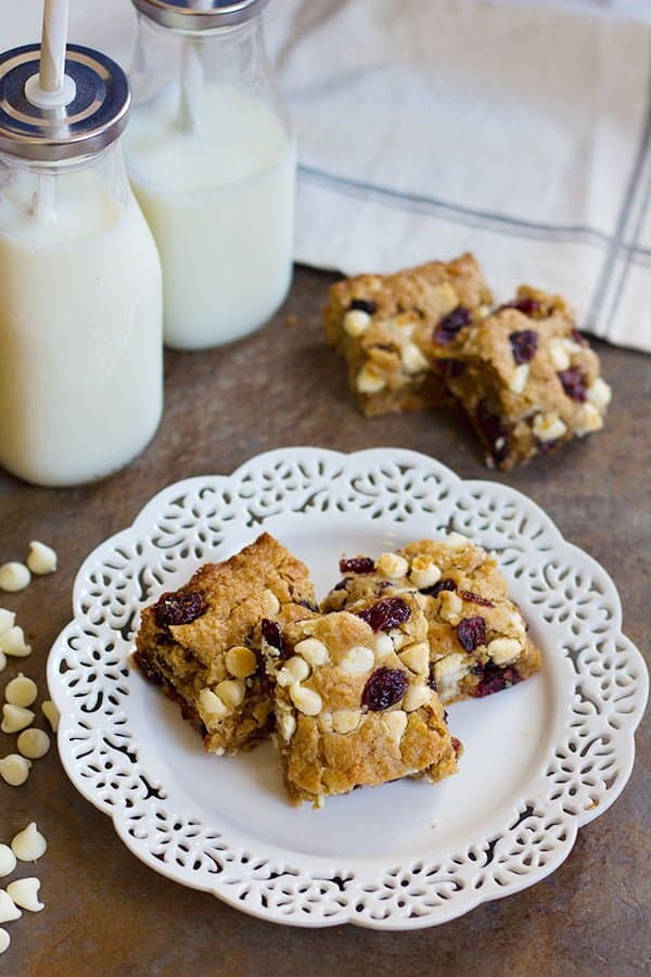 These Cranberry White Chocolate Oatmeal Cookie Bars have all the good flavors in one single bite! Sweet and tart cranberries go very well with festive white chocolate morsels!
