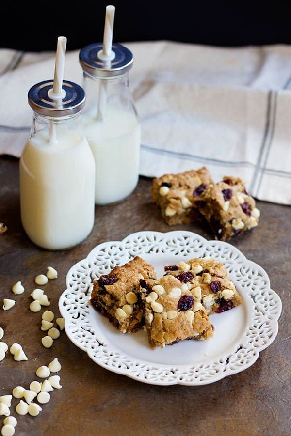These Cranberry White Chocolate Oatmeal Cookie Bars have all the good flavors in one single bite! Sweet and tart cranberries go very well with festive white chocolate morsels!