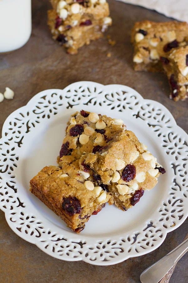 These Cranberry White Chocolate Oatmeal Cookie Bars have all the good flavors in one single bite! Sweet and tart cranberries go very well with festive white chocolate morsels!
