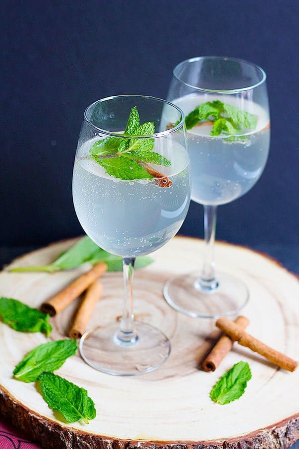 This Persian Cinnamon Mint Refresher will be your new favorite drink to serve at parties. A concentrated syrup infused with mint and cinnamon mixed with sparkling water for the right amount of fizz.
