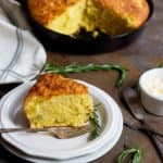 This Rosemary Cheddar Corn Bread is moist and full of delicious flavors. It's packed with aromatic rosemary baked in a cast iron skillet and has a beautiful crispy crust.