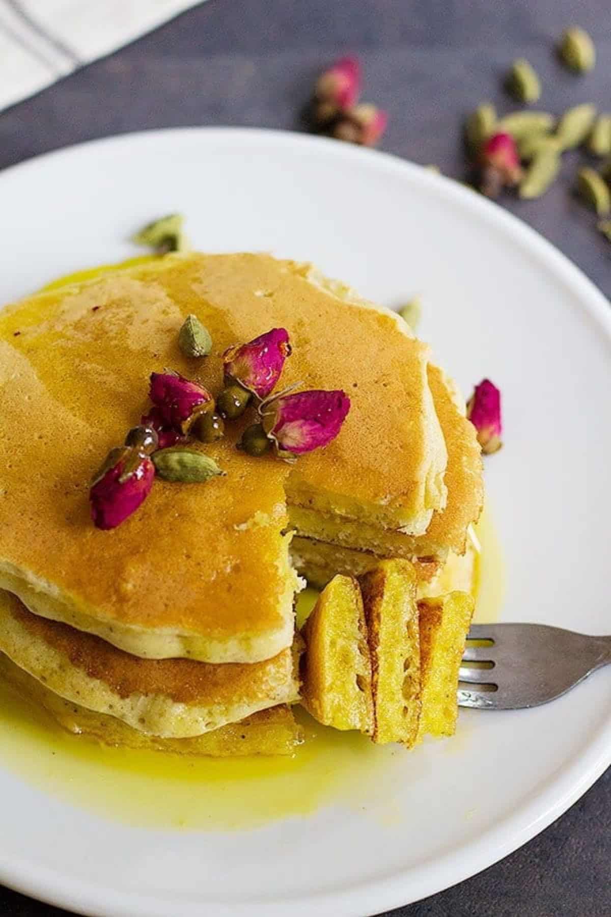 A classic American recipe with a Persian twist, these rosewater cardamom pancakes with saffron syrup are the love between east and west. The fluffy pancakes with rose and cardamom aroma kissed by saffron syrup, a dream come true!