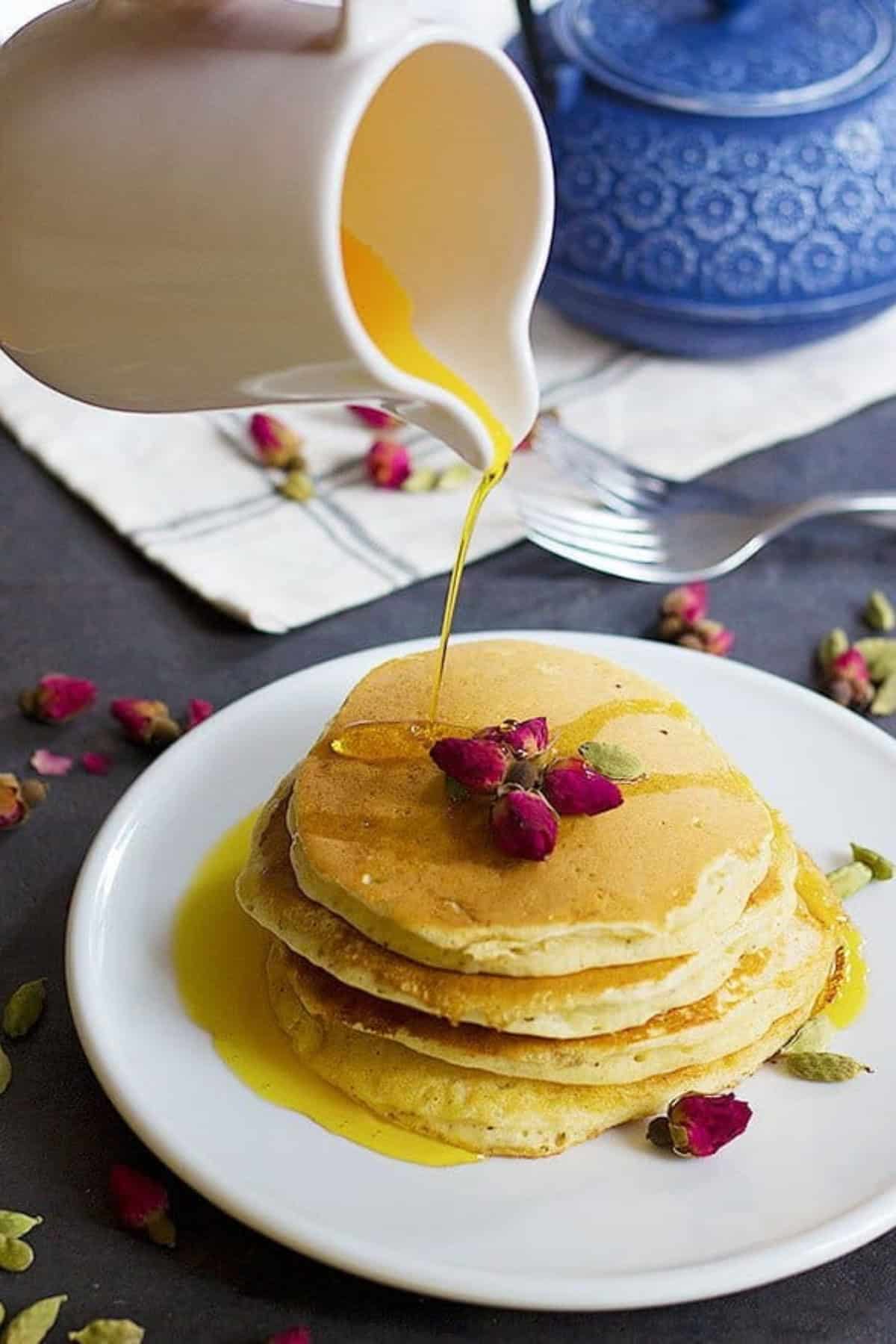 A classic American recipe with a Persian twist, these rosewater cardamom pancakes with saffron syrup are the love between east and west. The fluffy pancakes with rose and cardamom aroma kissed by saffron syrup, a dream come true!