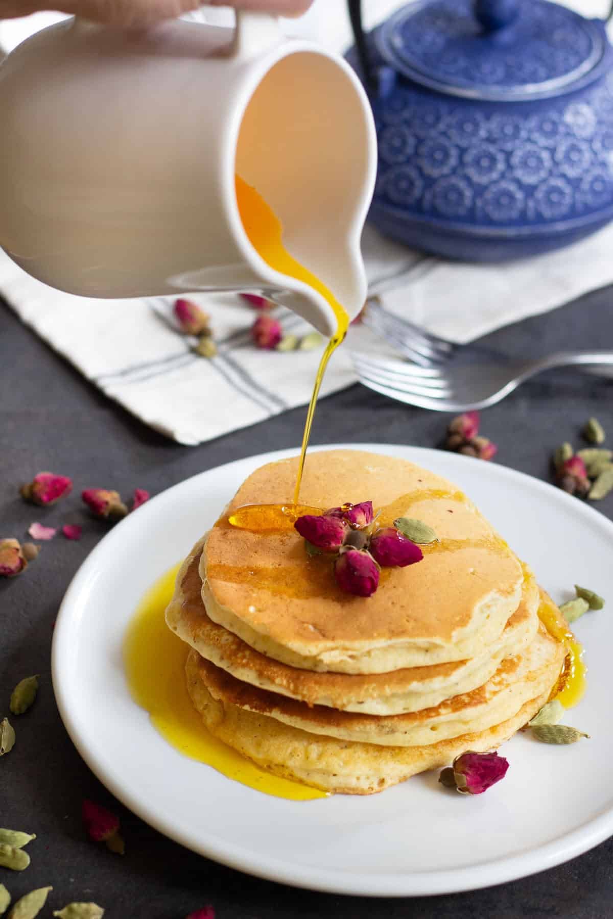 A classic American recipe with a Persian twist, these rosewater cardamom pancakes with saffron syrup are the love between east and west. The fluffy pancakes with rose and cardamom aroma kissed by saffron syrup, a dream come true! 