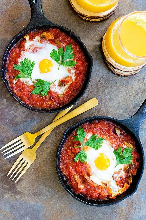 Baked Eggs with Sausage and Mushroom is a perfect breakfast dish for any day of the year. Fresh mushrooms and delicious sausage mixed with an amazing tomato sauce baked in the oven with eggs, can't get any better! 
