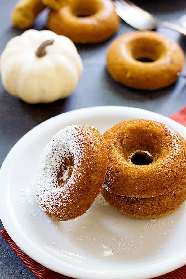 Baked Pumpkin Donuts are so simple and can be made in less than an hour using basic ingredients that are already in your pantry. From UnicornsintheKitchen.com