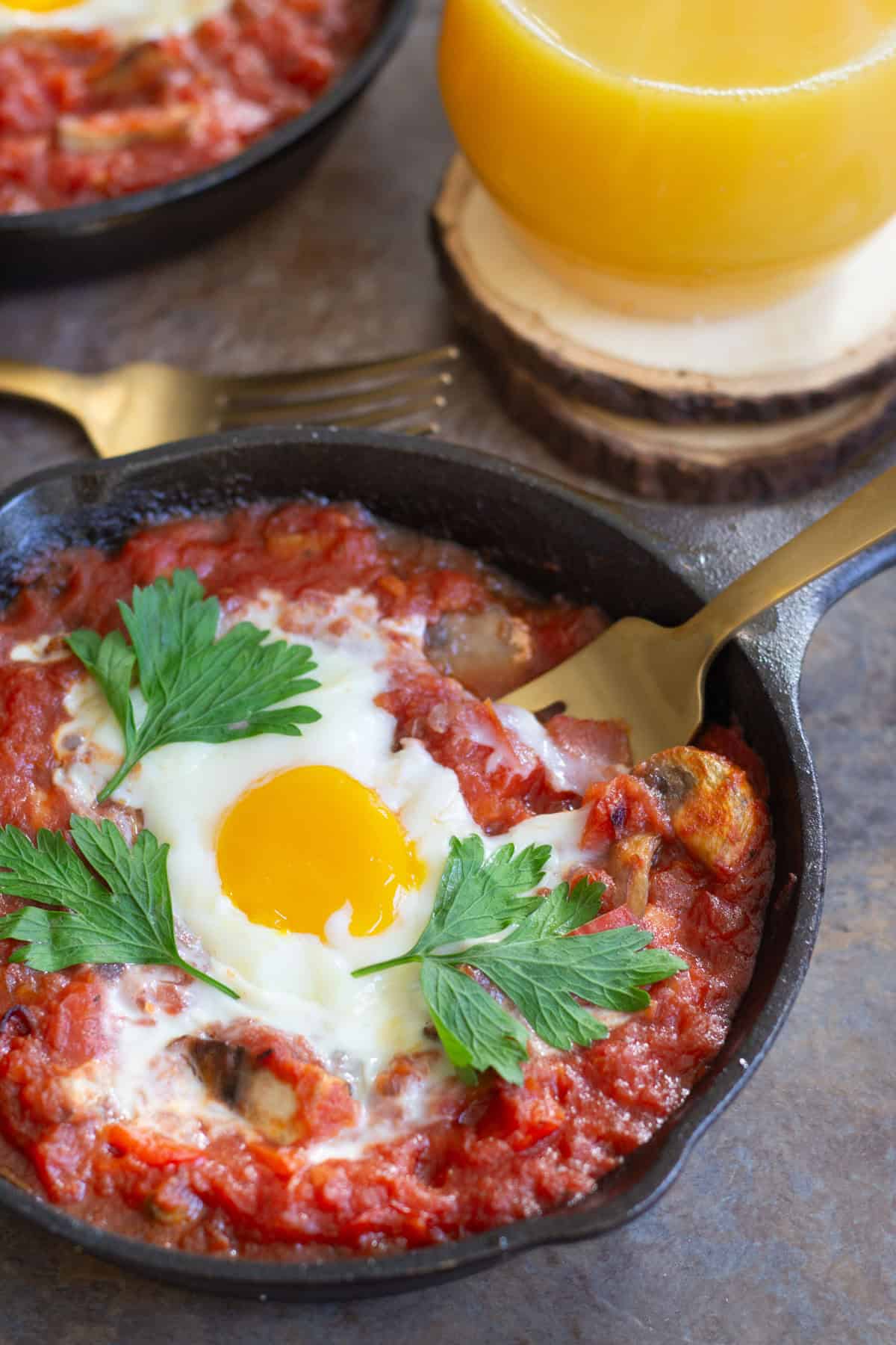 Baked Eggs with Sausage and Mushroom is a perfect breakfast dish for any day of the year. Fresh mushrooms and delicious sausage mixed with an amazing tomato sauce baked in the oven with eggs, can't get any better! 