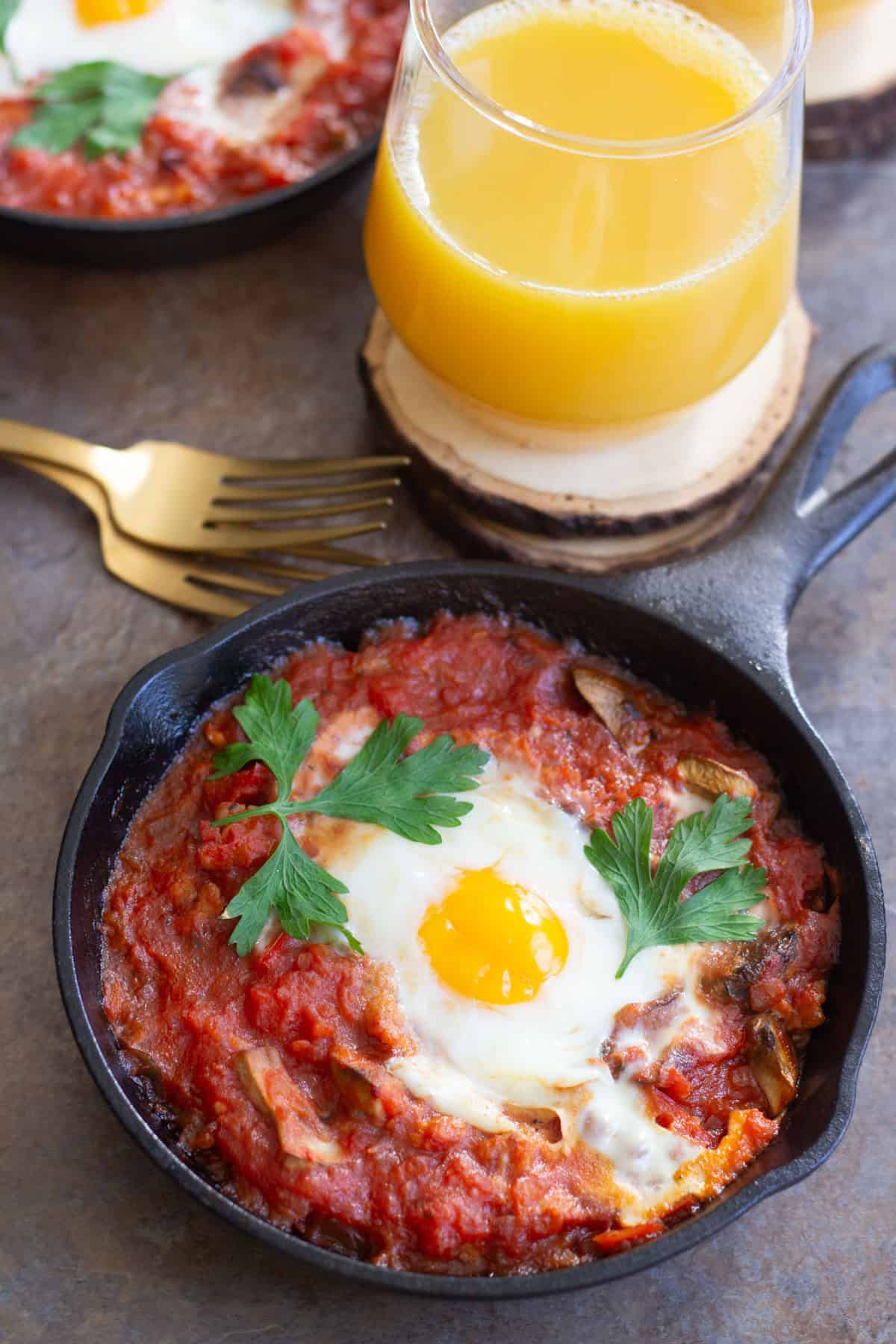 Baked Eggs with Sausage and Mushroom is a perfect breakfast dish for any day of the year. Fresh mushrooms and delicious sausage mixed with an amazing tomato sauce baked in the oven with eggs, can't get any better! 