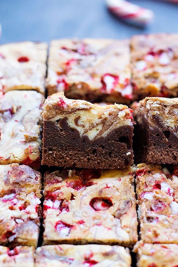 a piece of brownie with cheesecake layer on top.