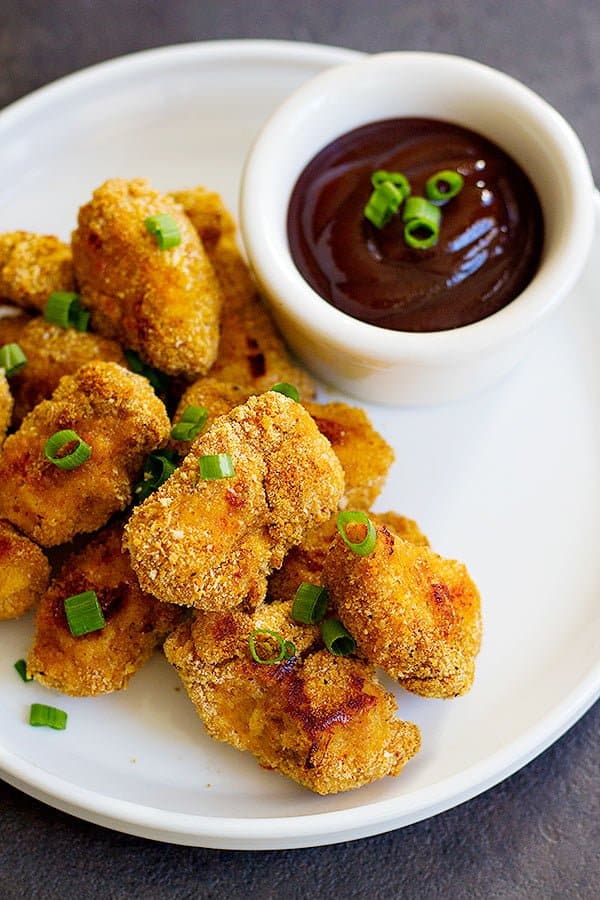 Baked Cajun Chicken Nuggets are perfect for parties or as a light meal. They are perfectly baked in the oven and by using a very simple technique, your fingers won't get all sticky!