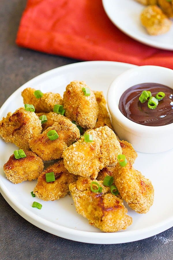 Baked Cajun Chicken Nuggets are perfect for parties or as a light meal. They are perfectly baked in the oven and by using a very simple technique, your fingers won't get all sticky!