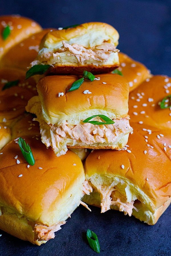 Buffalo chicken sliders are so simple to make and can easily feed a crowd. Creamy gooey sliders packed with flavor and heat from buffalo sauce!