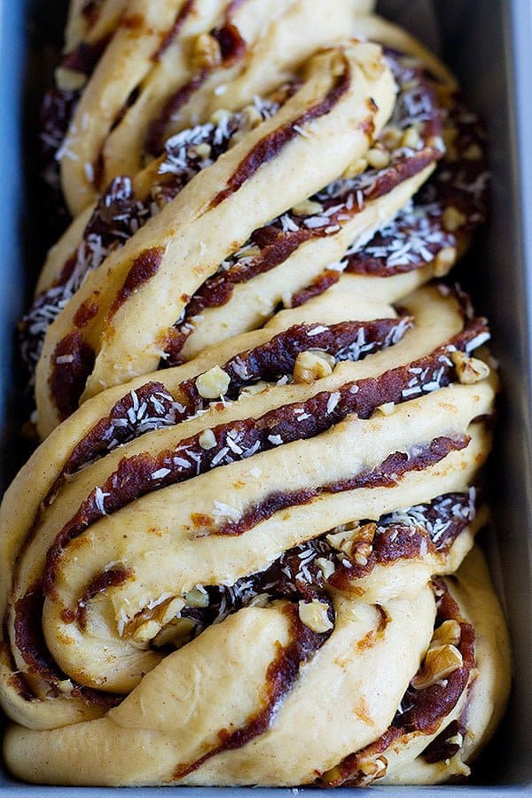 Unbaked date walnut babka made with dates and walnuts and coconuts. 