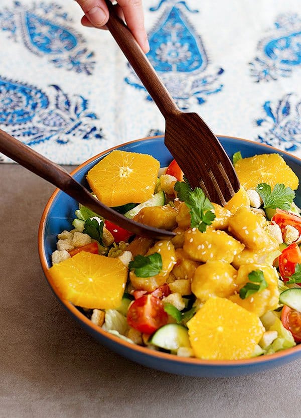 Bring excitement and flavor to ordinary dinners with this delicious orange chicken salad. Fresh salad topped with chicken smothered in lip-smacking orange sauce!