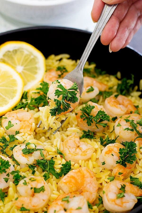 Start spring with this light and delicious Lemon Ginger Shrimp Orzo. It's full of fresh flavors and you can make it with just a few ingredients in only 25 minutes!